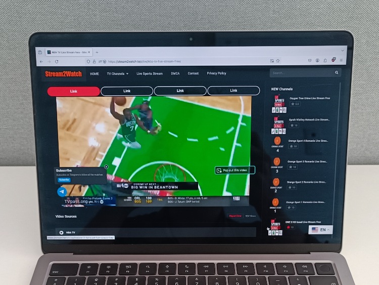Streaming live basketball content on Stream2wetch.top using a laptop