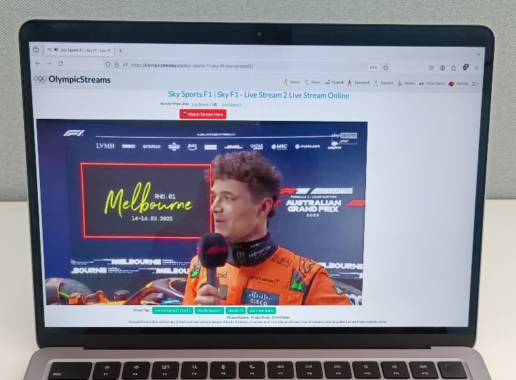 Live sports coverage playing on Olympicstreams.co via a laptop