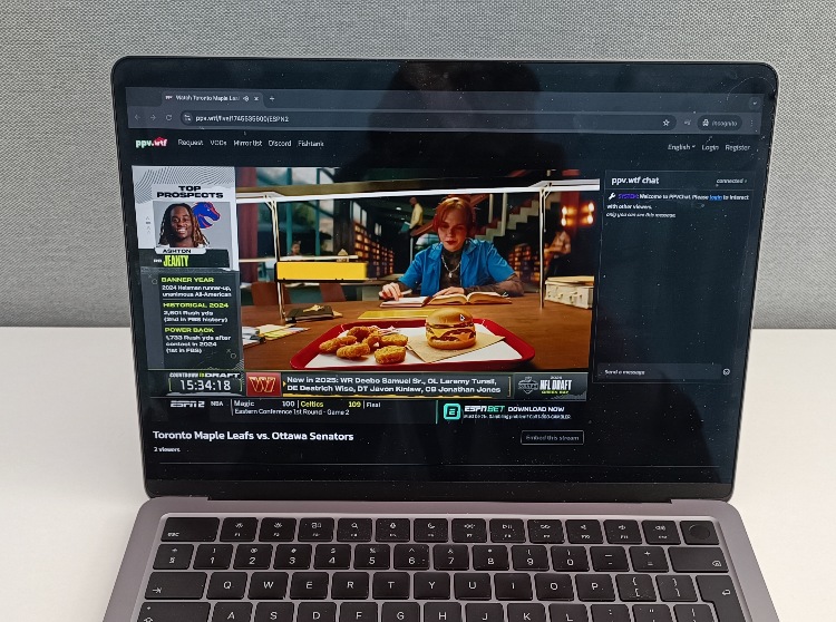 Close-up view of PPV.WTF airing a live sports event on a laptop