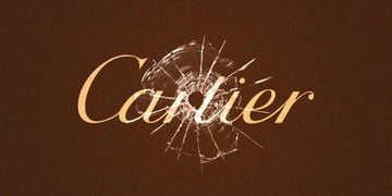 Cartiel logo written in italic and in gold, behing broken glass, bronze background