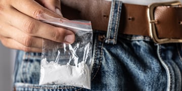 jeans, right pocket, little plastic bag with white powder inside