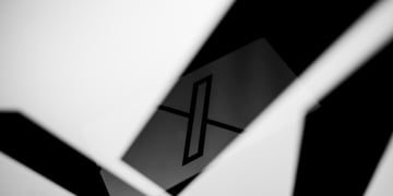X logo in white light and shadows